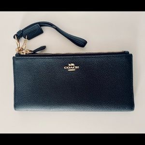 Black Coach Wallet. Two zipper compartments. Twelve card slots.